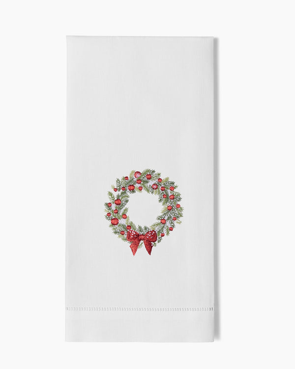 Photo of the Wreath Snow Embroidered Linens ensemble.
