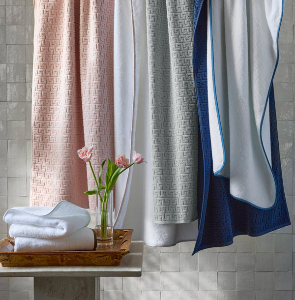 Sferra Athena bath towels in blush, white, silver, and navy greek key jacquard.