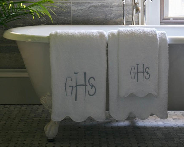 Matouk Scallop towels on bathtup