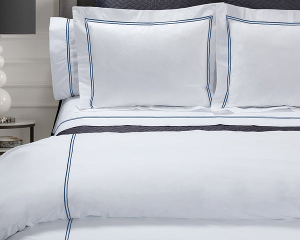 Photo of the Mimosa Embroidered Sheets + Duvet Sets | Bedding ensemble.