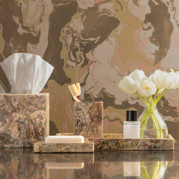 Adana Bath collection in marbled brown tones, styled with tulips on reflective surface.