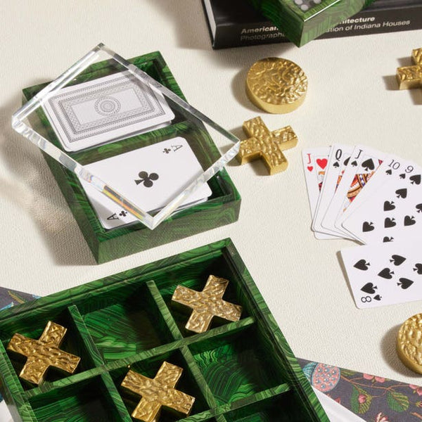 Barrington green malachite game set with gold tic-tac-toe pieces and playing cards on cream surface.
