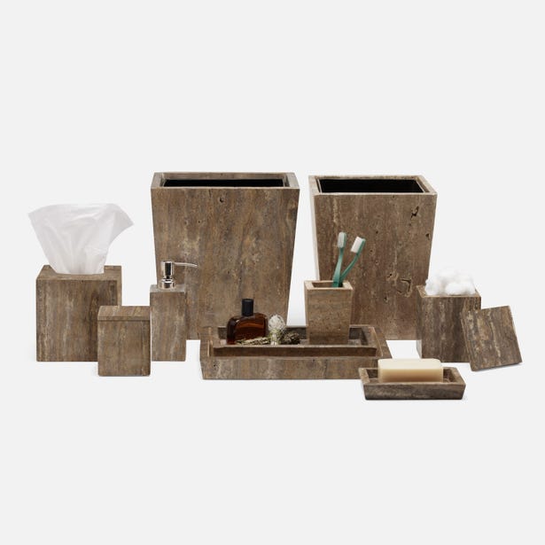 Bowen bath accessories collection in travertine stone, styled grouping on white background.