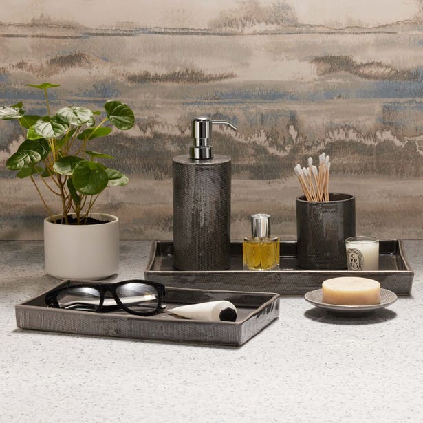 Cordoba bath accessory set in charcoal, styled on counter with tray, soap dish, and dispenser.