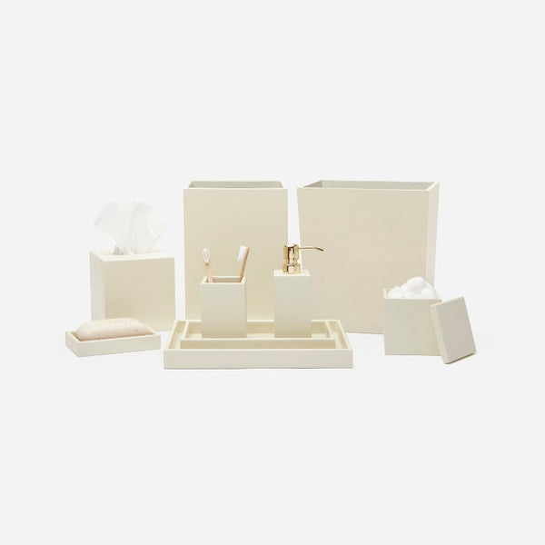 Dannes ivory bath accessory set with gold-tone pump dispenser, tissue box, tray, and canisters.