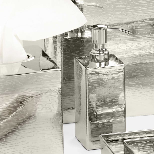 Elgin silver textured soap dispenser with pump, styled in a bathroom setting.
