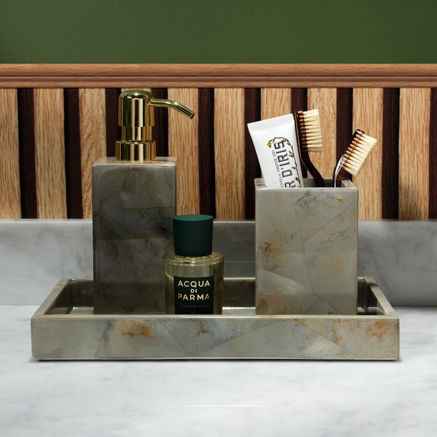 Gorman bath accessories set in grey marble finish, styled on a marble countertop.