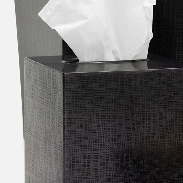 Close-up of Remy charcoal tissue box cover with woven texture embossing and tissue.