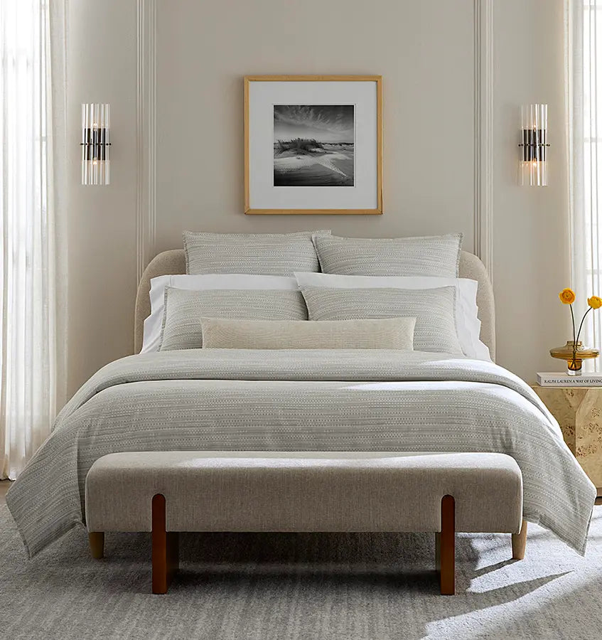Pellestrina ivory textured linen bedding styled on a bed with neutral bedroom decor.