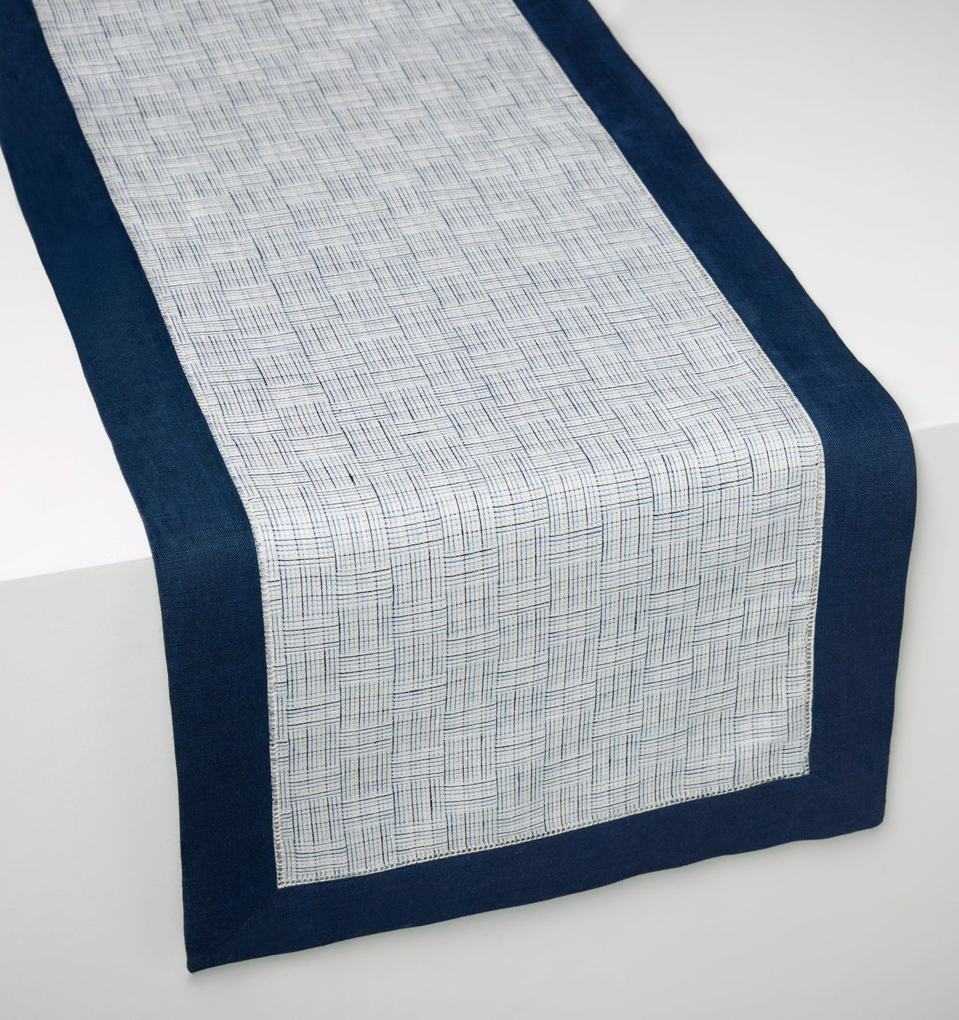 Mikelina table runner in navy border with woven silver-grey linen center panel.