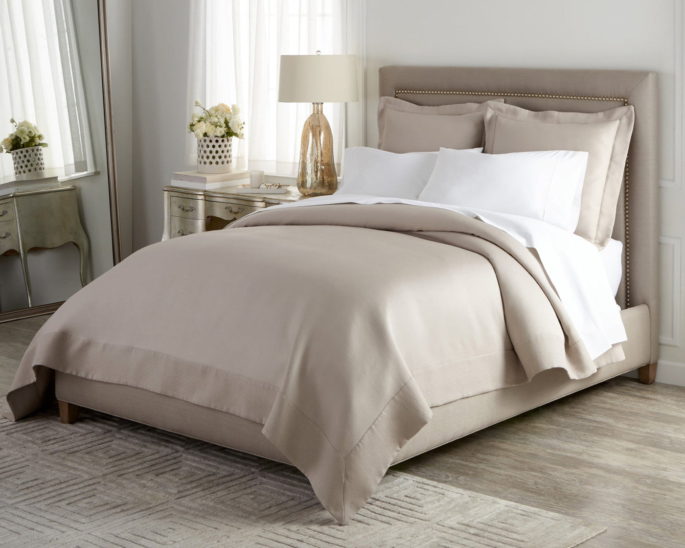 100% cotton pique Angelina coverlet and shams in linen on comfortable bed