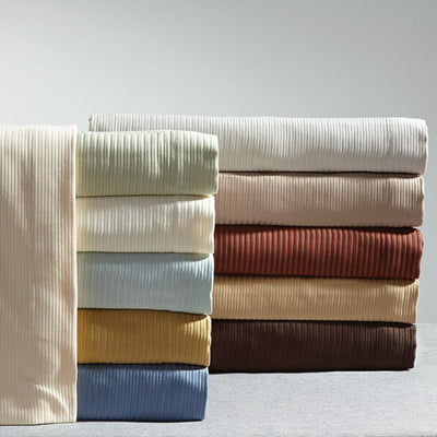 Aristocrat ribbed bedding collection in ivory, sage, sky, gold, denim, blush, brick, and chocolate.