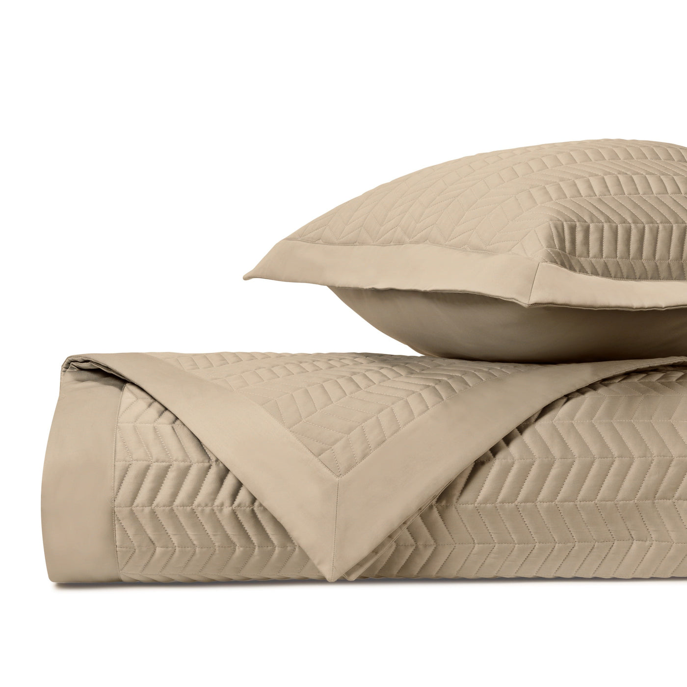 Chester quilted bedding set in khaki with chevron stitch pattern, folded coverlet and sham.