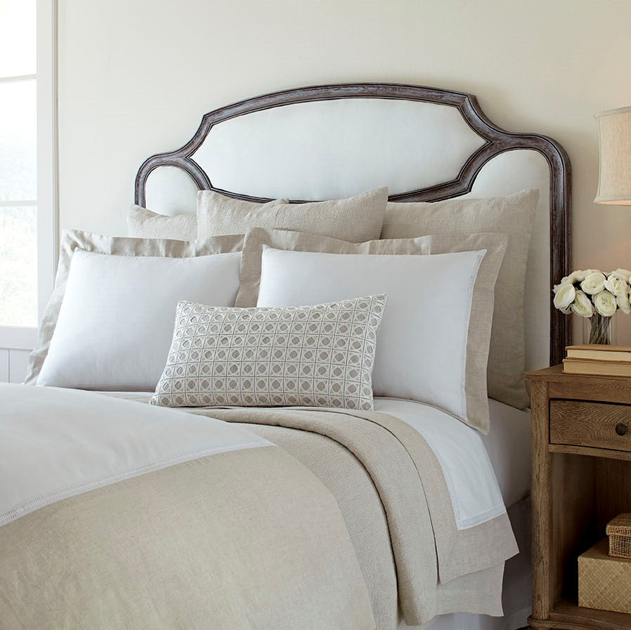 Linea linen bedding collection in white and natural with geometric accent pillow.