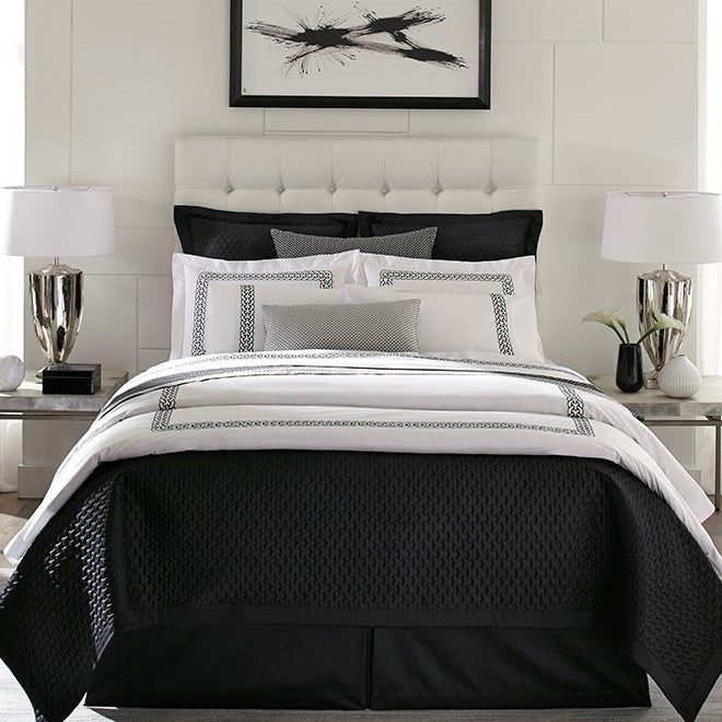 Sferra Links bedding collection in onyx and ivory with geometric border detail.