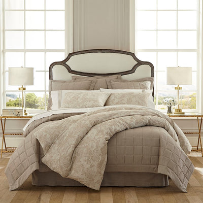 Medici taupe floral bedding collection with quilted coverlet on styled bed.