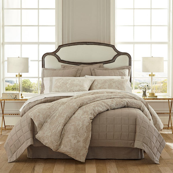 Medici taupe floral bedding collection with quilted coverlet on styled bed.