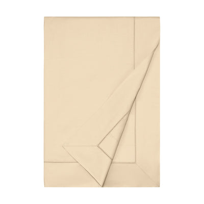 Sferra Miller champagne flat sheet folded with hemstitch border detail.