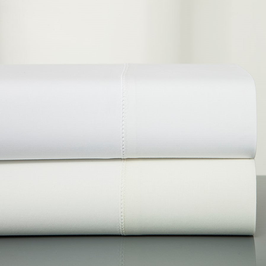 Sferra Plush 1000 folded flat sheets in white and ivory with hemstitch detail.
