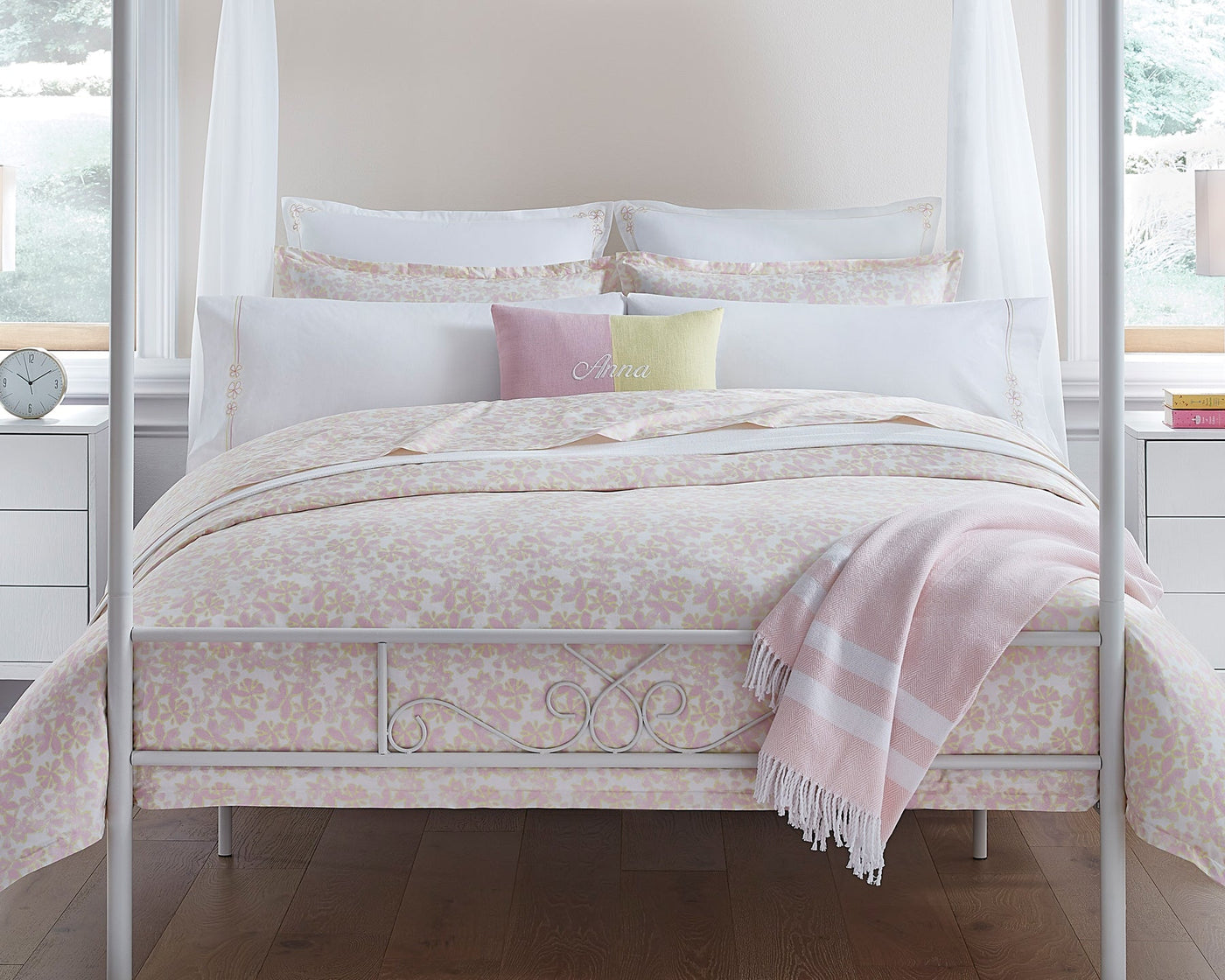 Bed with pink and yellow floral bedding