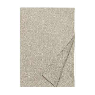 Primavera flat linen sheet in sage with ivory floral jacquard pattern, folded flat.