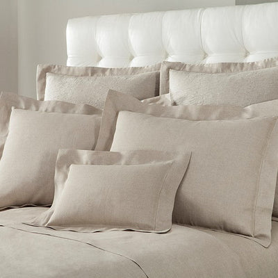 Provenza linen bedding collection in natural, styled with multiple pillow sizes on a bed.