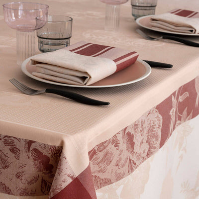 À la Française blush and burgundy floral jacquard tablecloth with coordinating napkin.
