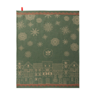 Village de Noël green cotton jacquard tea towel with a winter village scene.