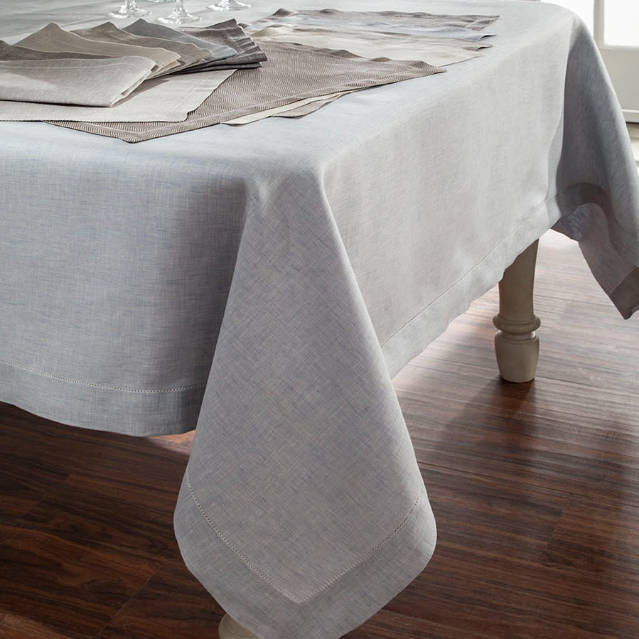 Zebra silver linen tablecloth on dining table with matching placemats and napkins.