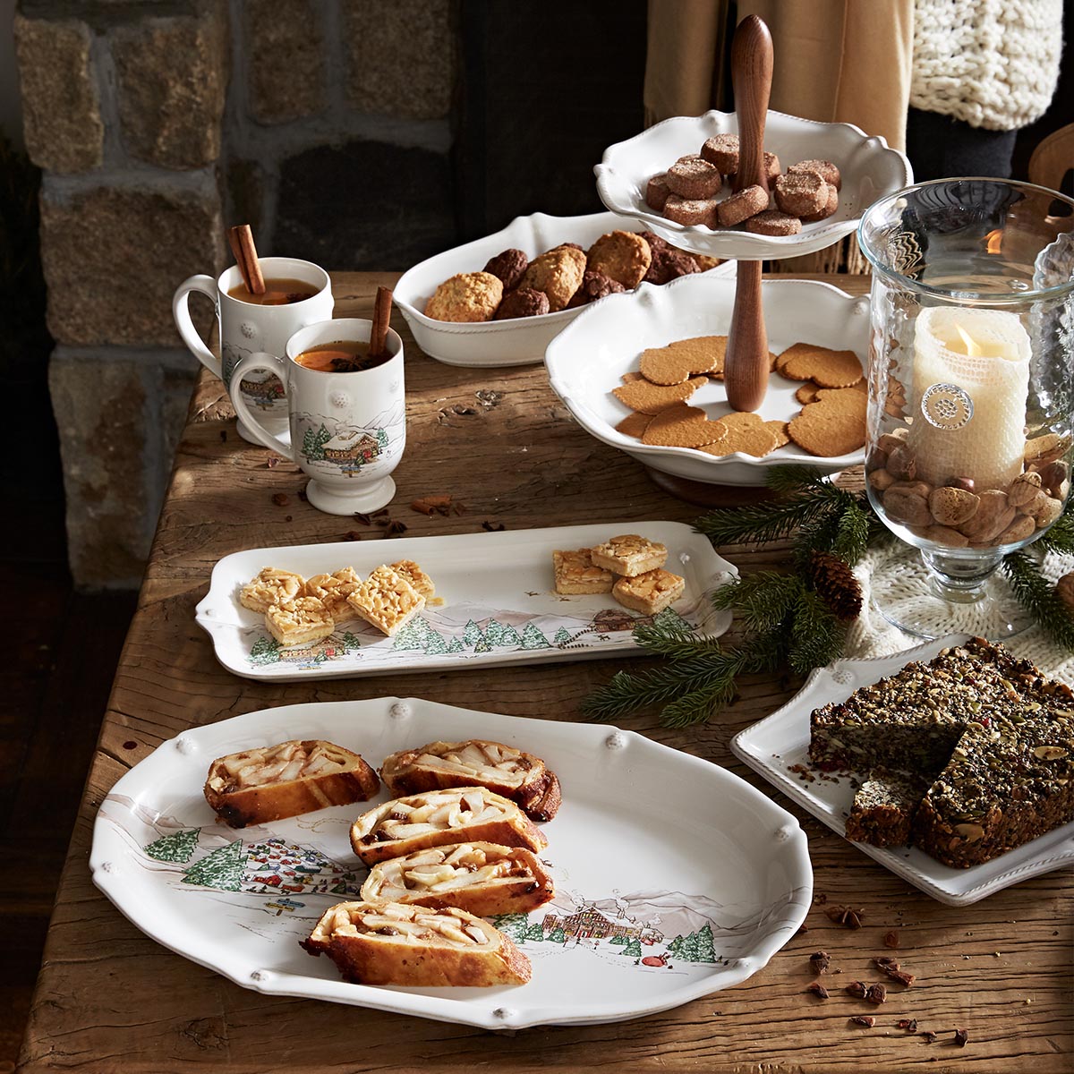 North Pole platter and hostess tray set with holiday baking on a wooden table
