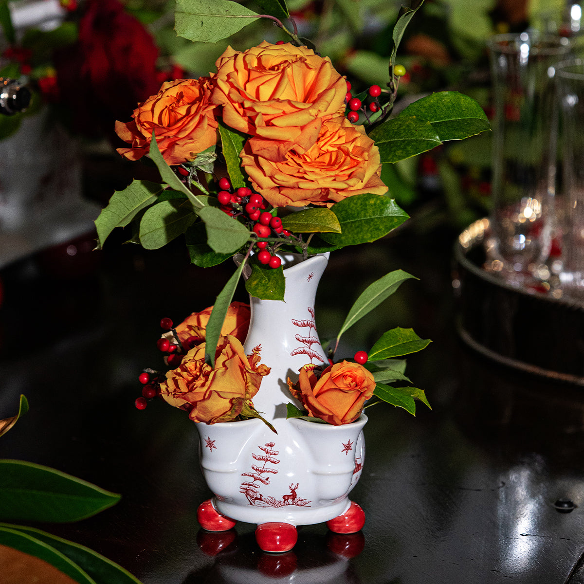 Ruby Winter Frolic petite tulipiere vase with orange roses and berries