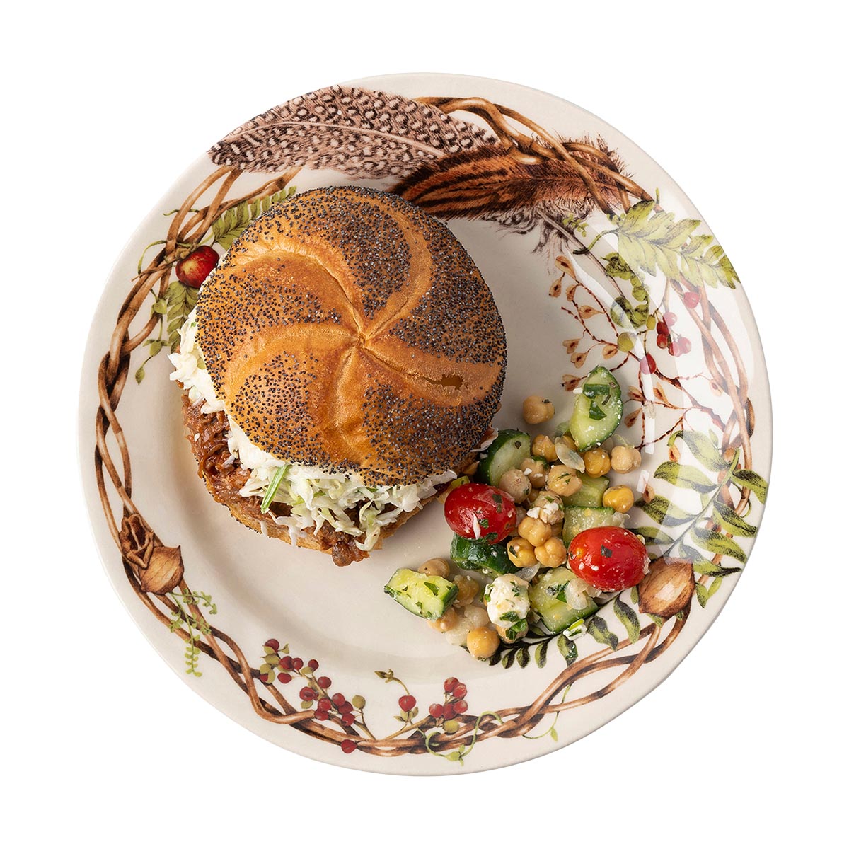 Forest Walk dinner plate with a sandwich on a seeded bun and a chickpea and tomato salad