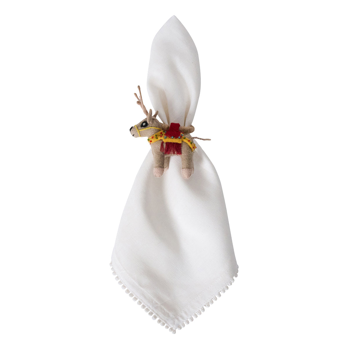 White napkin in a felt reindeer napkin ring