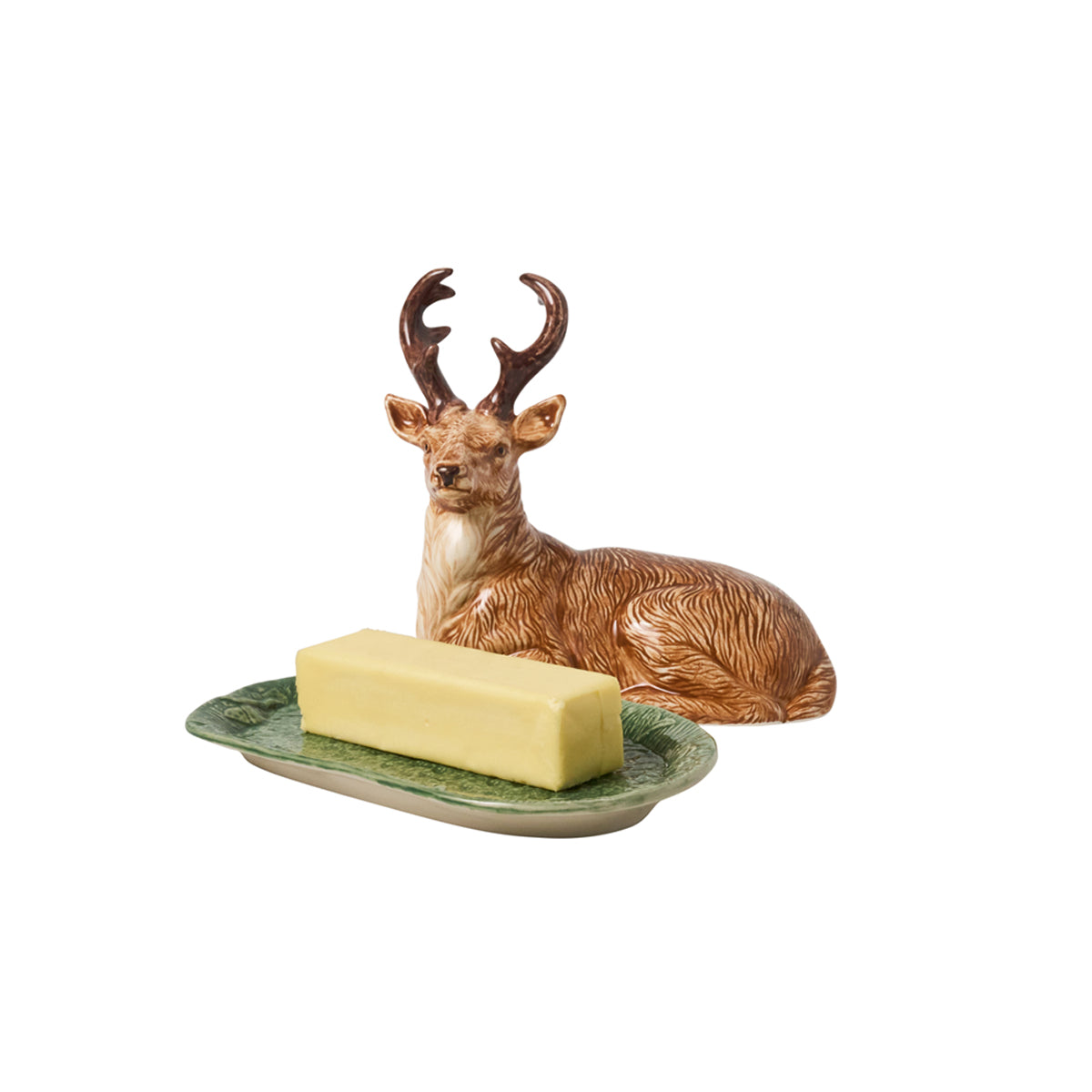 Juliska Forest Walk stag butter dish with the lid off, showing a stick of butter on the green base
