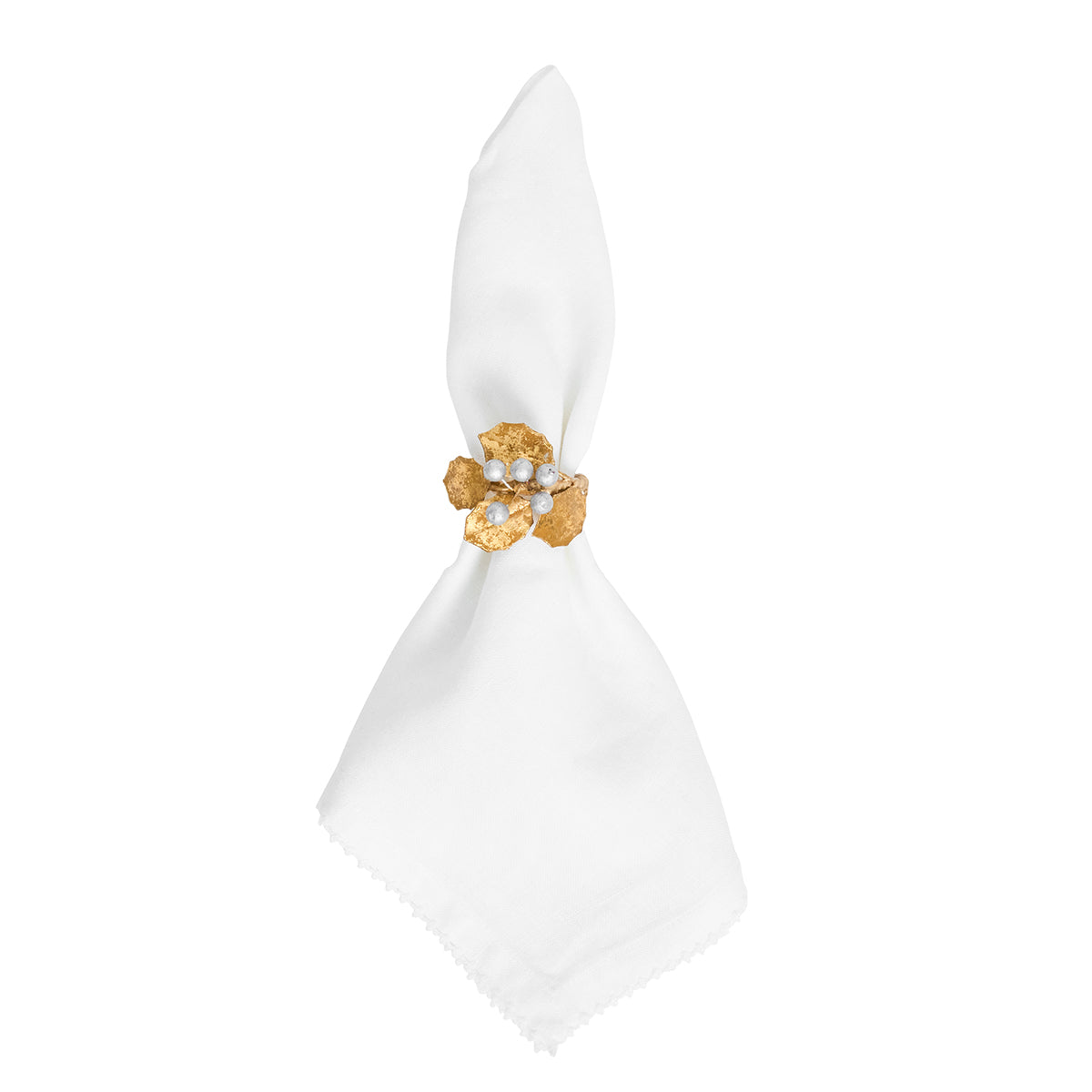 Juliska Forest Walk gold holly napkin ring with silver berries on a white napkin