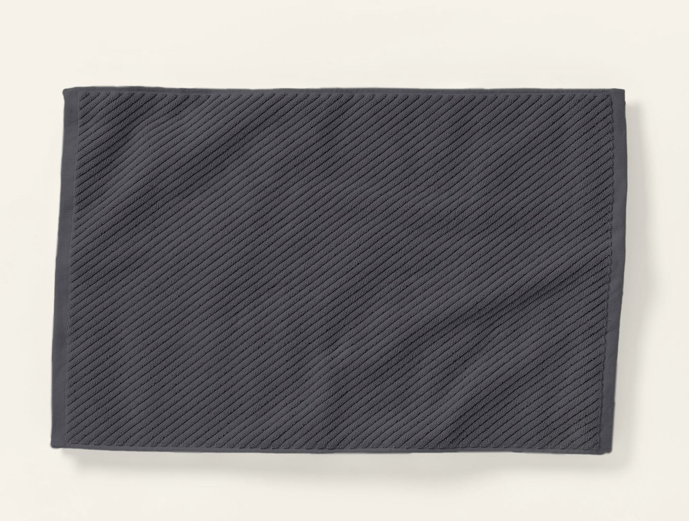 Slate grey twill-weave bath rug, flat lay showing diagonal ribbed texture.