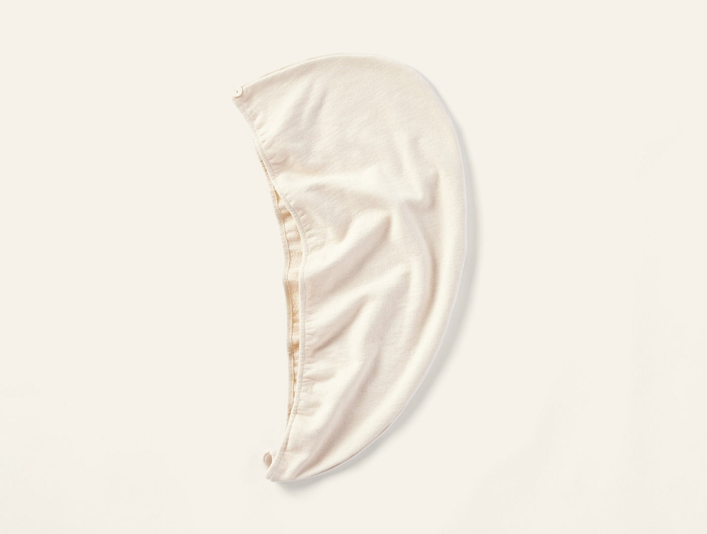 Coyuchi Bare Hair Wrap in natural ivory, displayed flat on white background.