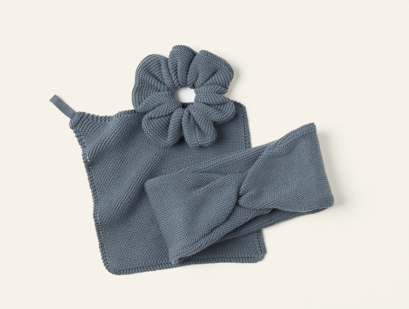 Coyuchi Bare Knit Gift Set in slate blue with scrunchie, headband, and washcloth.