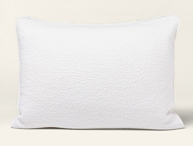 Coyuchi Cascade Matelassé pillow sham in white with textured woven surface.