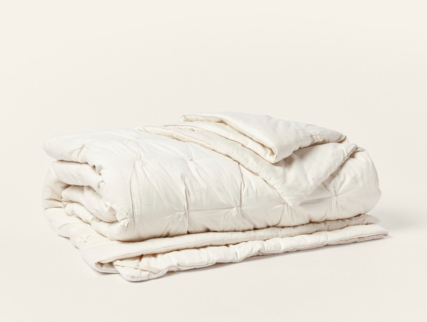 Coyuchi Climate Beneficial Cotton duvet insert, ivory, folded with pintuck quilting detail.