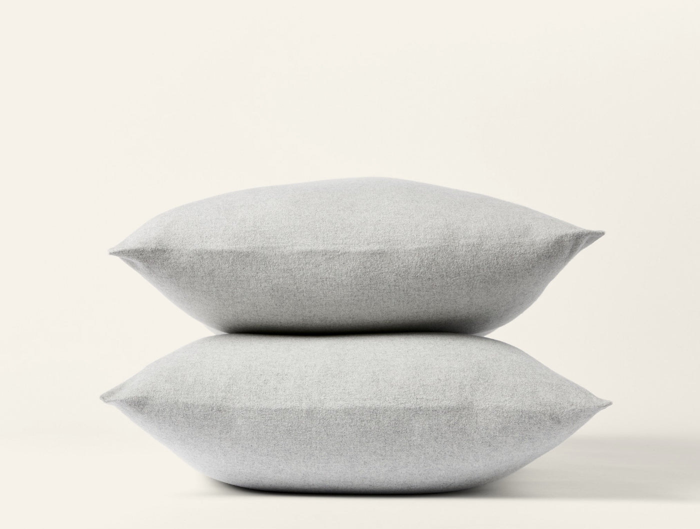 Two stacked Coyuchi Cloud Brushed Flannel pillowcases in silver mist, showing plush texture.