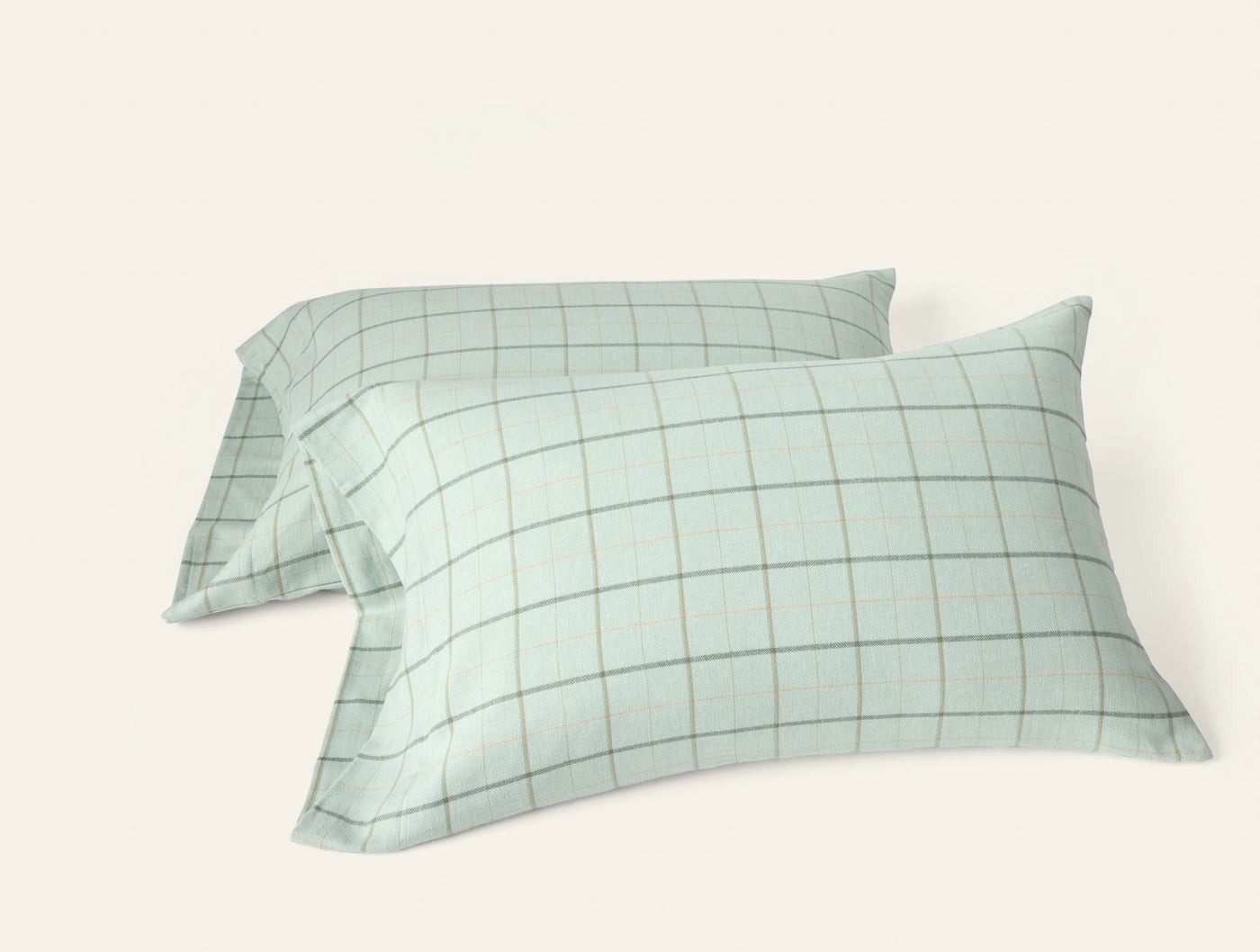 Two sage green flannel pillowcases with fine grid check pattern, shown as a stacked pair.