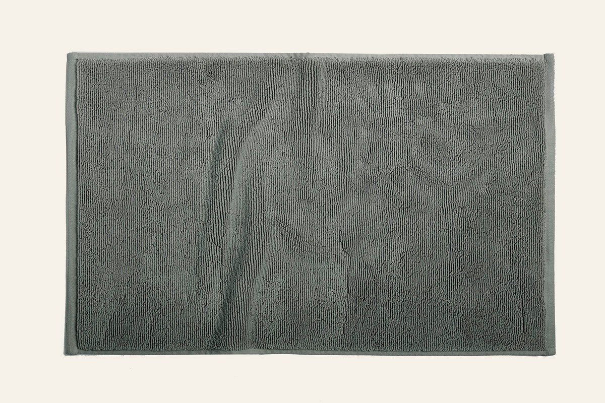Coyuchi Cloud Loom bath sheet in slate grey, showing full flat lay with plush terry texture.