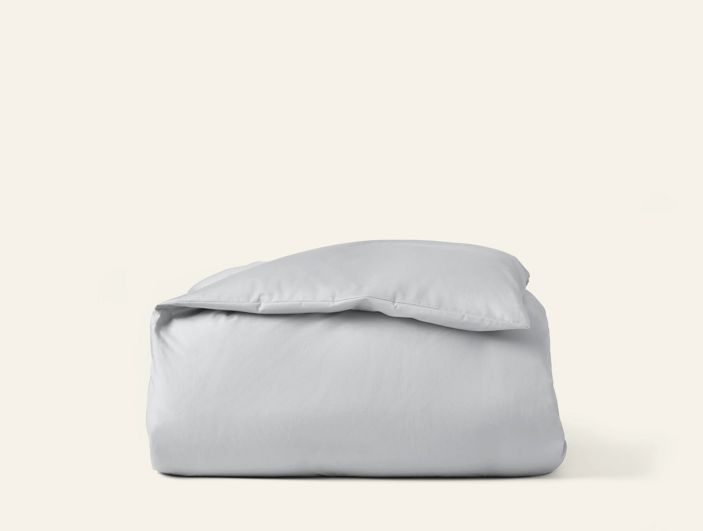 Coyuchi Cloud Soft Sateen duvet cover folded neatly, shown in silver-grey.