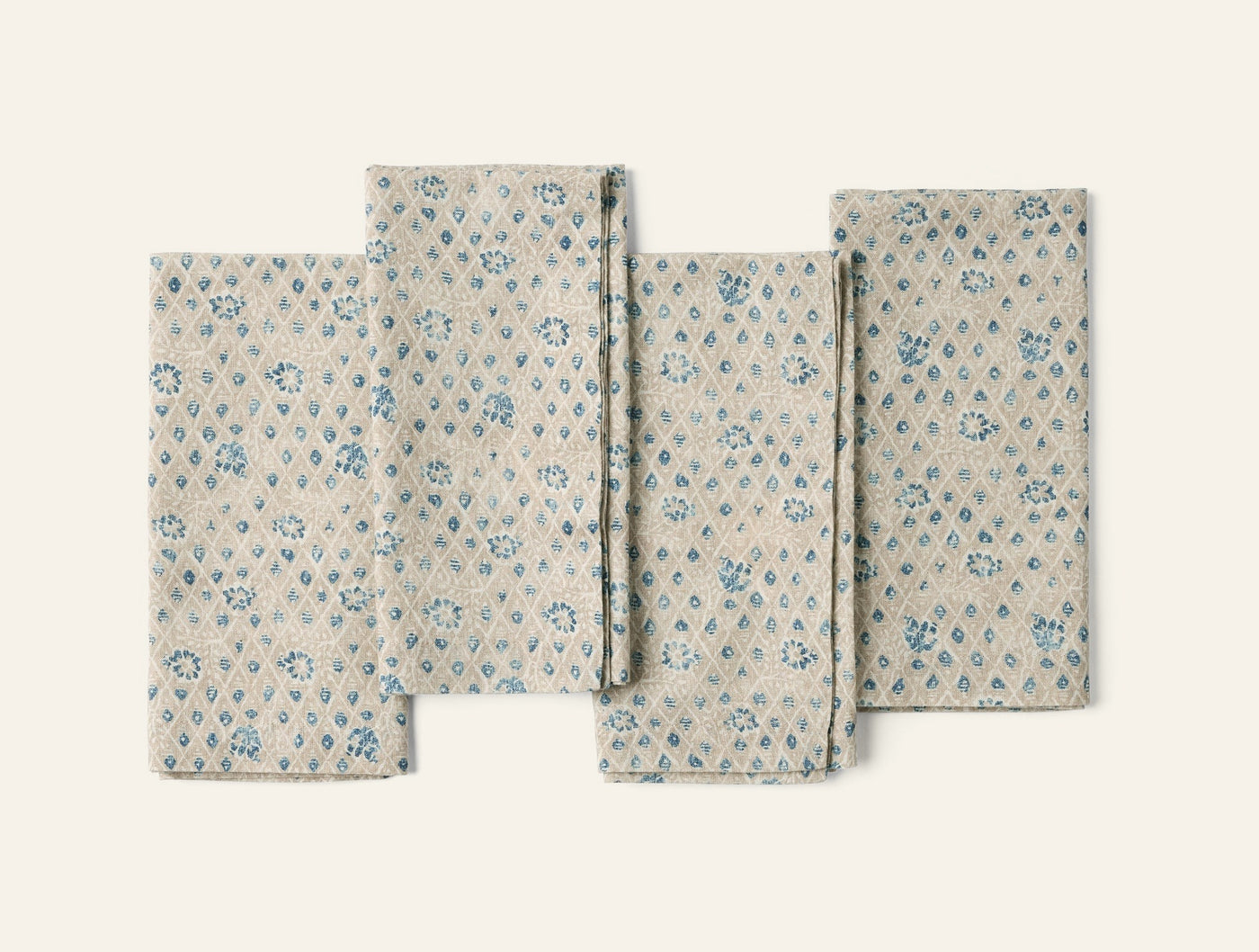 Coyuchi Coral Bell Print napkin set, natural linen with blue floral diamond block print.