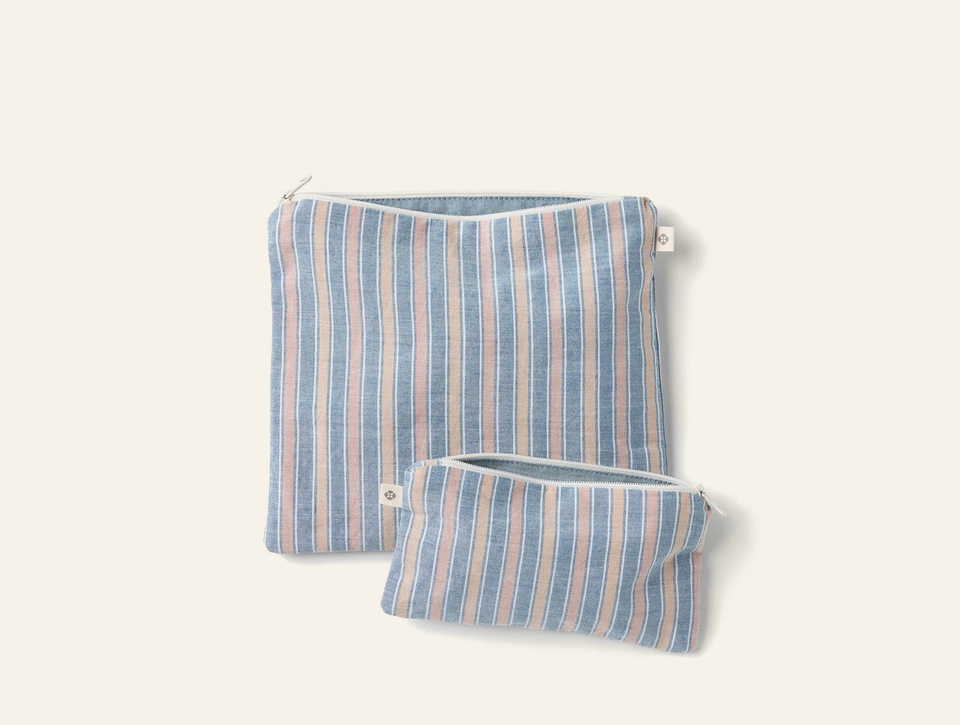 Coyuchi striped linen snack bag set, large and small, blue and blush tones.