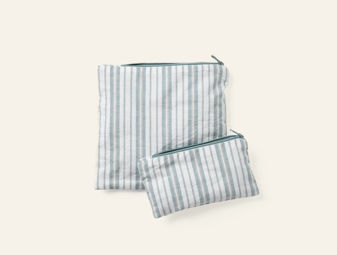 Coyuchi Conserve snack bag set in sage stripe, large and small pouches with zipper closure.