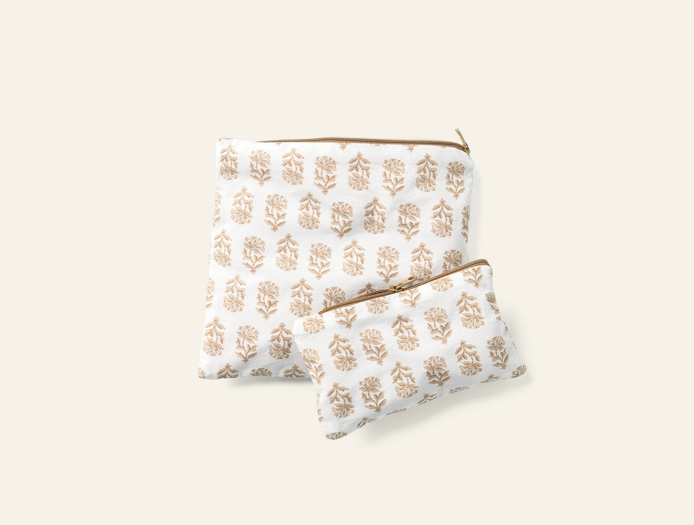 Coyuchi block-printed snack bag set in ivory and tan botanical motif, two sizes.