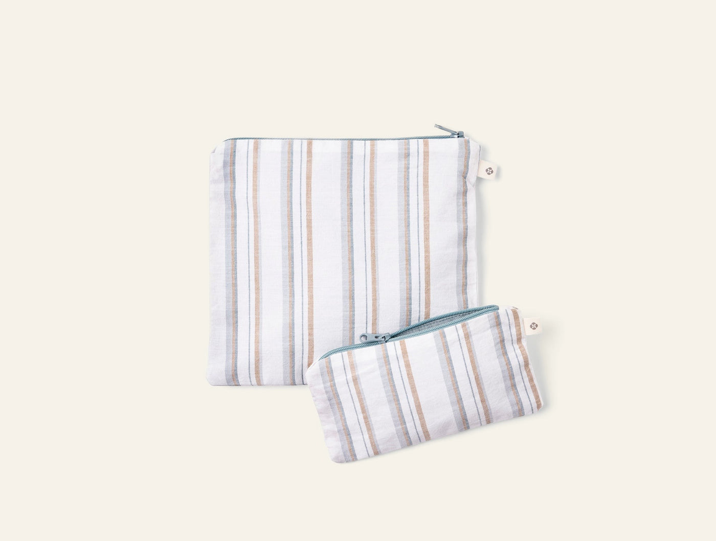Coyuchi Conserve snack bag set, two sizes, ivory linen with tan and blue stripes.