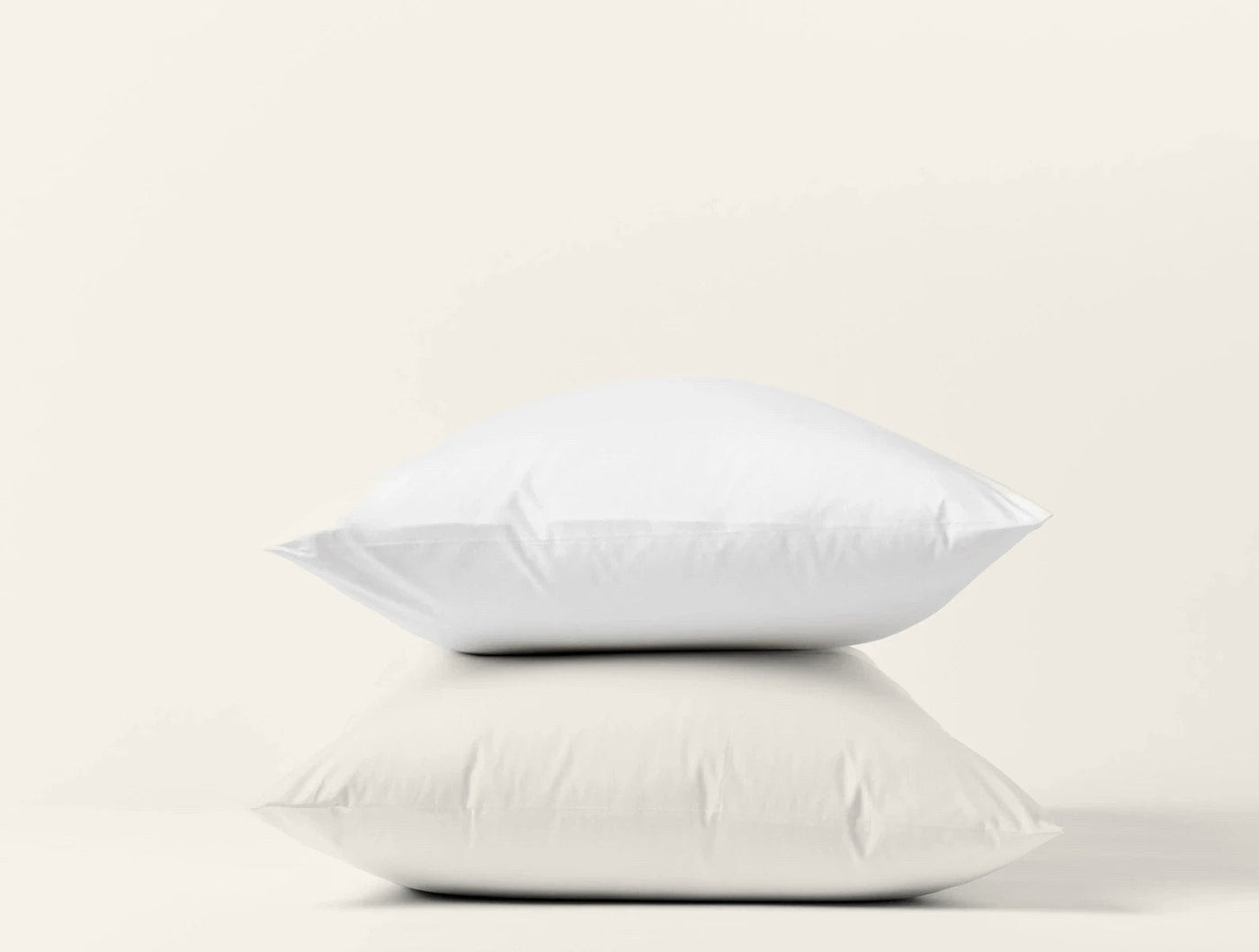 Coyuchi Heritage Percale pillowcase pair in white, two pillows stacked on white background.